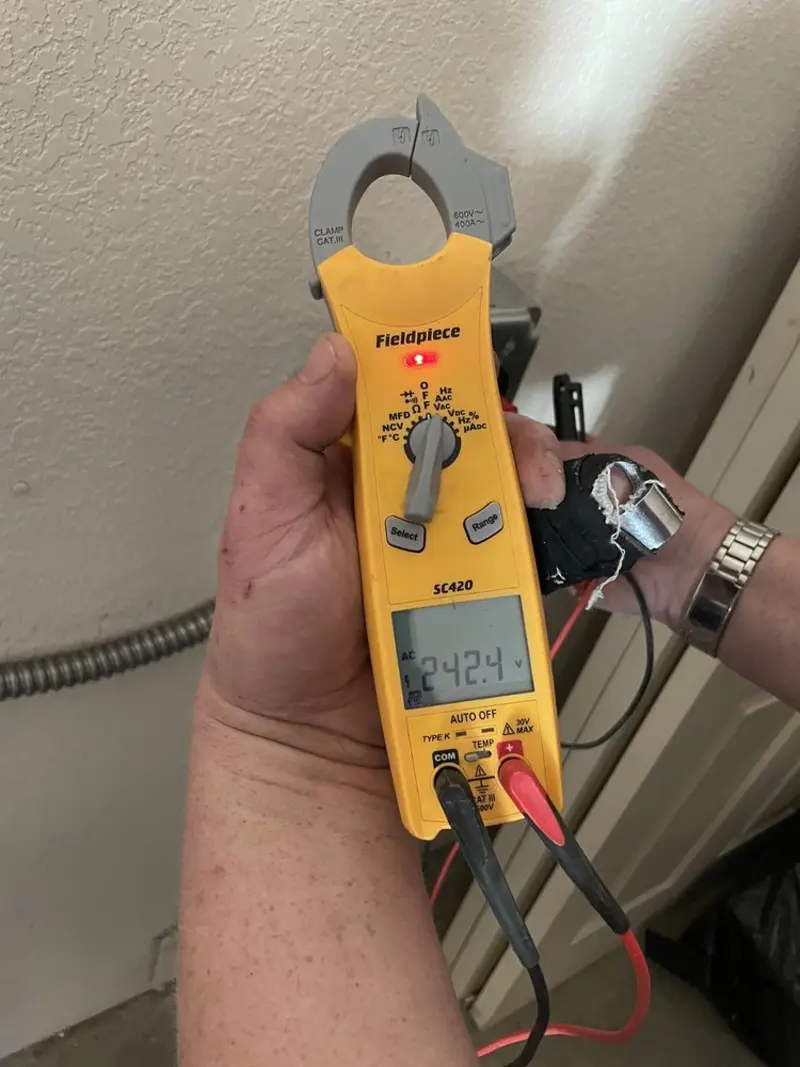 Voltage testing with clamp meter during Electrical Installation Services in Daleville